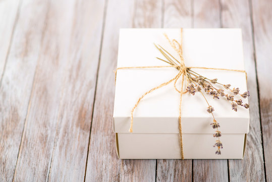 White Present Box With Rustic Twine And Sprig Of Lavender