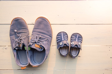 top view of father and baby shoe put together
