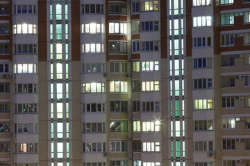 Fototapeta na wymiar view of residential building with bright windows
