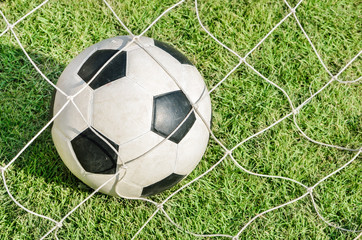 Soccer ball in goal, Close up image