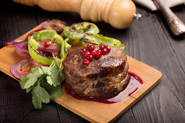 Grilled Steak Meat on the dark surface