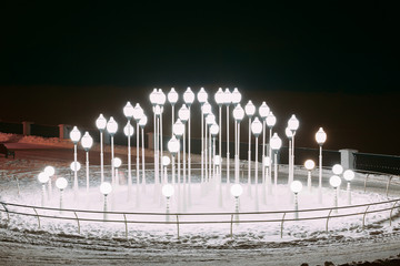 Lanters in Snowy winter city park. Night. Gomel, Belarus