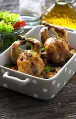 Roasted quail with vegetable on wooden background