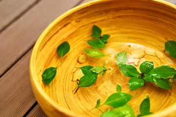Spa Body Treatment. Foot Spa Basin, Bowl With Water, Natural Ingredients : Peppermint Leaves, Ginger, Essential Oils, For Detox Aromatherapy In Health Beauty Salon, Centre. Skin Care Pedicure Therapy