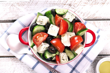 Greek salad in red boul