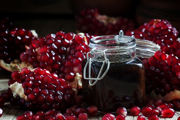 Pomegranate Jam, fresh pomegranate, dark wood background, select