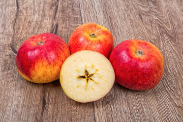 Ripe apples on a wooden background