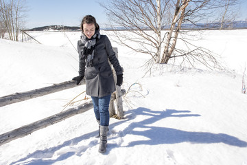 Portrait of happy young woman have fun at beautiful sunny winter day