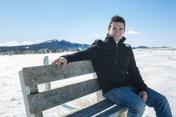 Handsome young man in winter nature