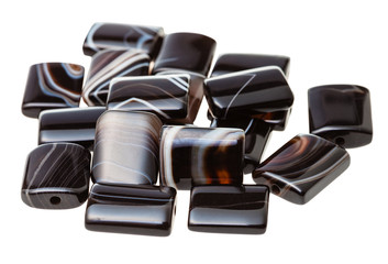 beads from brown banded agate gemstone on white