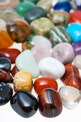 many polished natural mineral gemstones close up