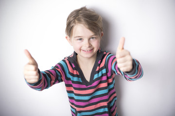 cute cheerful  little girl portrait, isolated on gray background