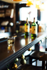 Whisky glass on bar
