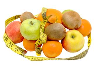 Fruits with measuring tape isolated on white
