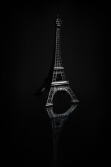 Souvenir copy of Eiffel tower on a dark background