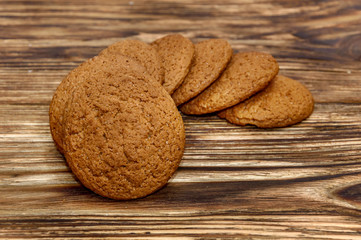 Oatmeal cookies on wooden background