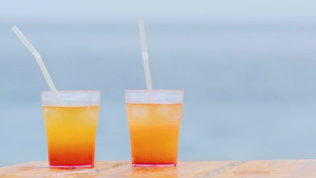 Two alcoholic cocktail on the background of the sea