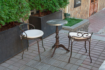 Cafe with tables and chairs in an street in Europe