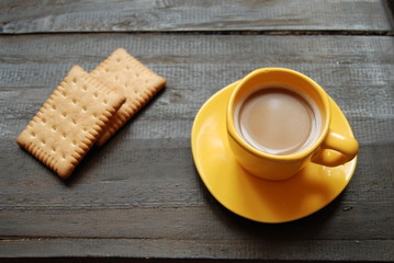 Instant Hot Coffee with plain biscuits on wooden background. Close-up, view from above.