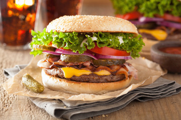 bacon cheese burger with pickles tomato onion