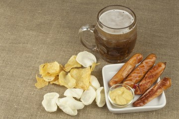 Grilled Sausage and potato chips. 

