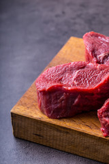 Steak. Raw beef steak. Fresh raw Sirloin beef steak sliced o Herb - Rosemary decoration.