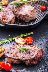 Grill beef steak. Portions thick beef juicy sirloin steaks on grill teflon pan or old wooden board.