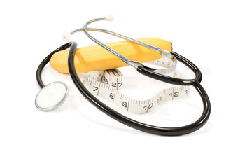 Phonendoscope, banana and measuring tape