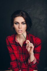 Obraz premium lollipop in the mouth (close-up) of woman