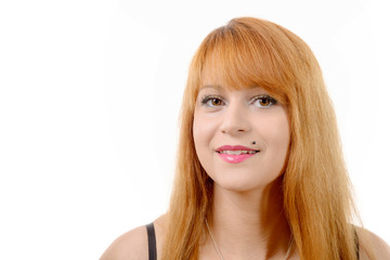 Naklejka premium portrait of a pretty young redhead with long hair, on white