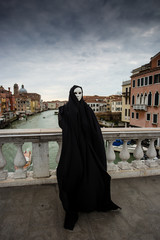 Woman in dark halloween like costume