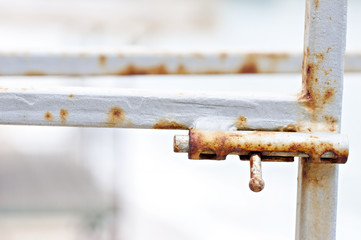Rusted lock on old gate