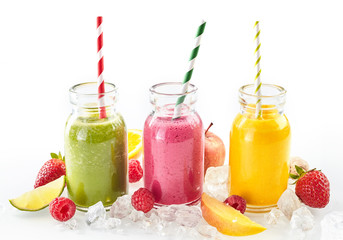 Long row of tropical fruit drinks in tall glasses