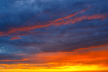 Obraz premium orange, blue and yellow colors sunset sky