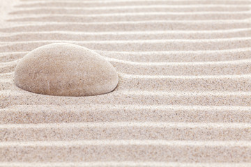 Fototapeta na wymiar Stone in sand, spa or spiritual background