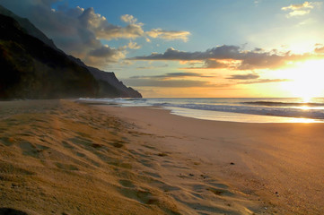Fototapeta na wymiar Secluded Kalalau Beach on the Na Pali Coast of Kauai, Hawaii at sunset