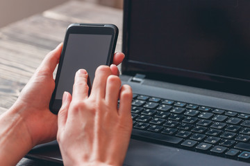 Female hands holding smartphone