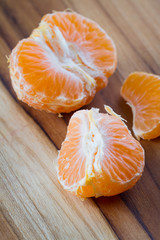 peeled orange on a cutting board