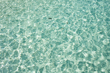 Beautiful blue water in seal with sun reflection