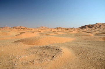 Fototapeta na wymiar Sand dune field under blue sky sahara