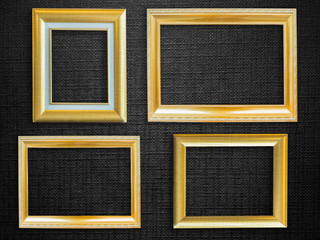 Fototapeta premium Golden picture frame over black background