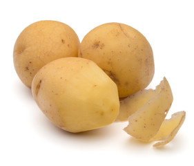 peeled potato tuber with peel spiral isolated on white backgroun