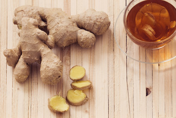 Ginger tea on wooden background