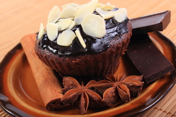 Baked muffins with pieces of chocolate, anise and cinnamon