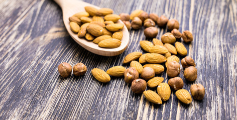 Almonds in wooden spoon 
