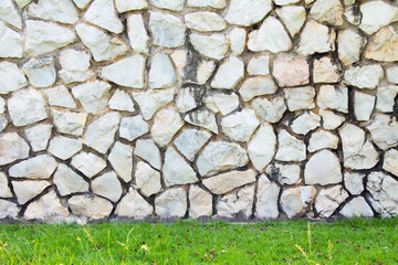 Rock in cement wall background 