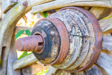 The old wooden cart wheel.