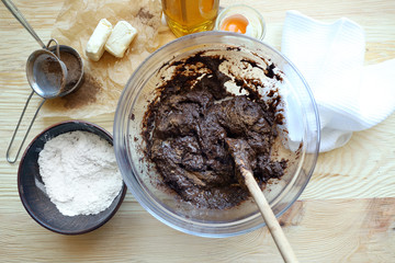 Preparing dough for chocolate pie on table close up