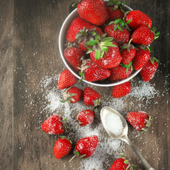 Strawberries in bowl with sugar