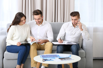 Fototapeta premium Estate agent meeting with happy couple, on light background